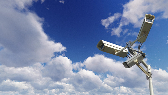 Security Cameras Against The Blue Sky