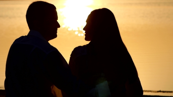 Couple In Love Sitting On River Bank Kissing Stock Footage Videohive