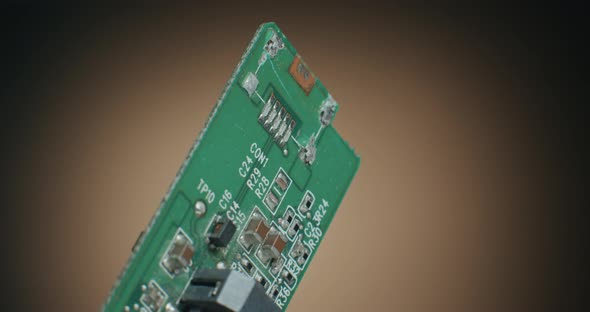 Close up of a Circuit Board PCB, SMD Parts and Macro Shot of Electronic Components on Turn Table alt