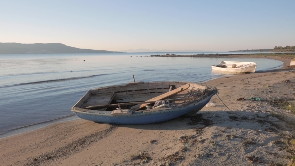 Empty Small Wooden Boats On The Beach
