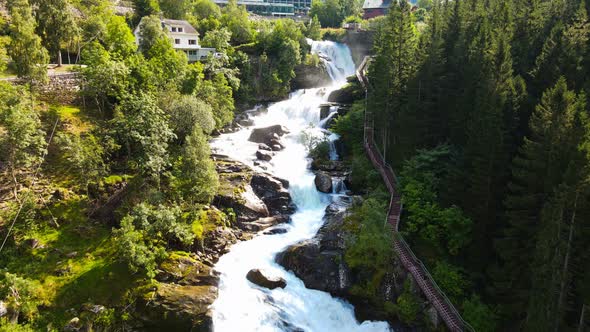 River Geirangerelvi and the waterfall Storfossen in Geiranger, Norway
