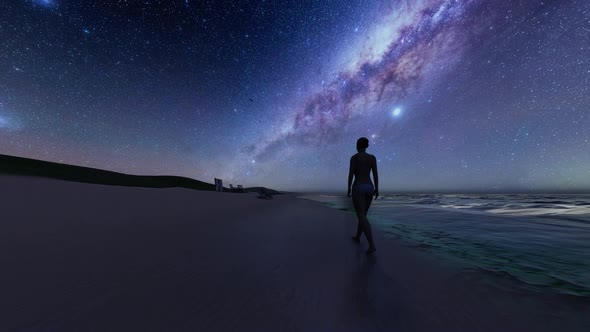 Sexy Woman Walking on the Beach with the View of the Milky Way