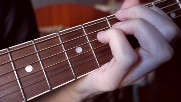 Fingers Clamped Chords On The Fingerboard