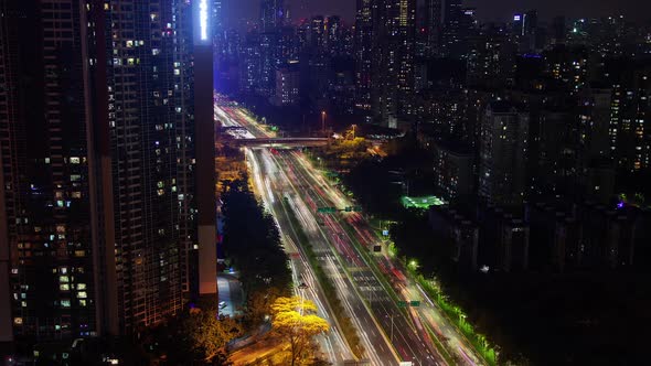 Timelapse Shenzhen Vehicles Drive Along Wide Highway alt