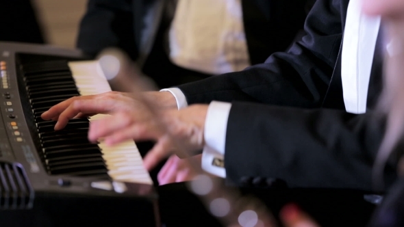 Pianist And Flutist Playing Together