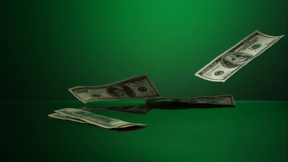 American $100 Bills Falling onto a Reflective Surface alt