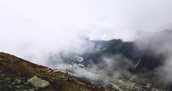 Mountain Foggy Valley, Misty Alps Landscape. Snowy Hazy Peaks in Brumous Cloudy Chamonix, Northern
