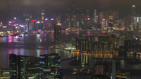 Timelapse Buildings Illumination Reflected in Hong Kong Bay alt