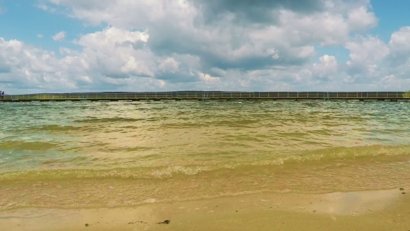 Yellow Sandy Beach With Cloudy Sky