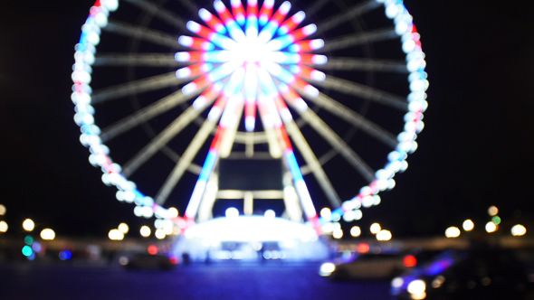 Blurry View on Paris Ferris Wheel During Christmas