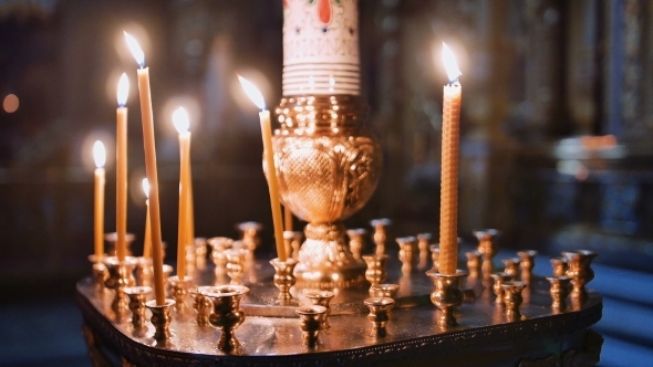Burning Candles Inside a Church alt