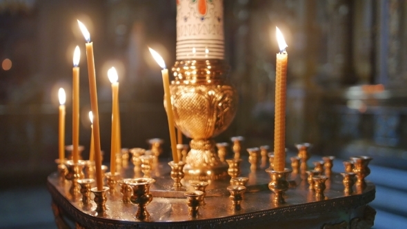 Burning Candles Inside a Church