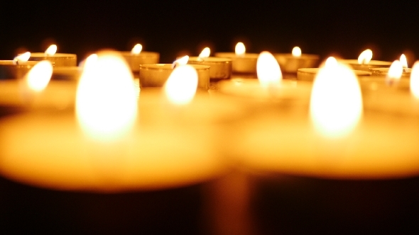 Burning Candles In Dark