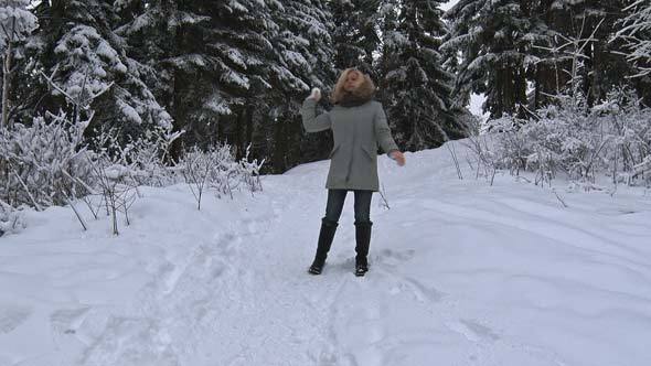 Girl Makes and Throws Snowball