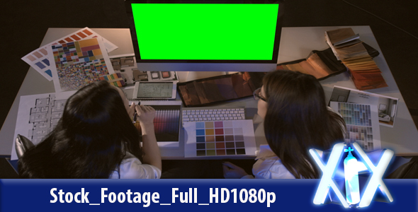 Young Female Artists Working On Computer At The Office alt