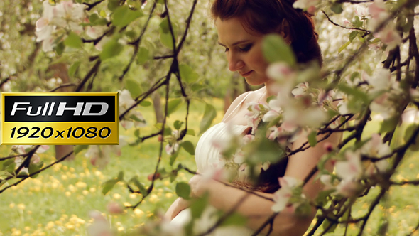 Happy Pregnant Woman In The Spring Garden alt