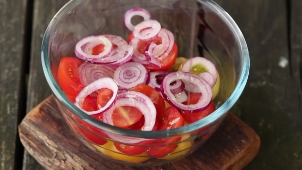Mixing Salad Of Tomatoes And Onions By Wooden