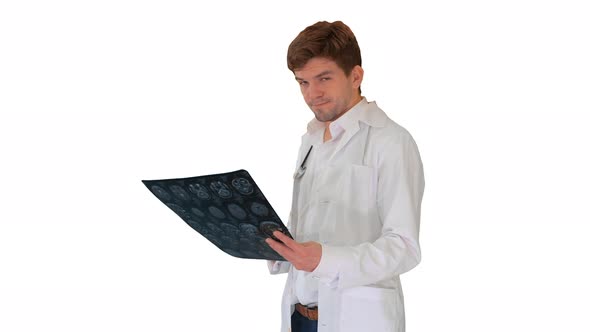 Male Doctor Checking Computed Tomography and Looking at Camera Approvingly on White Background
