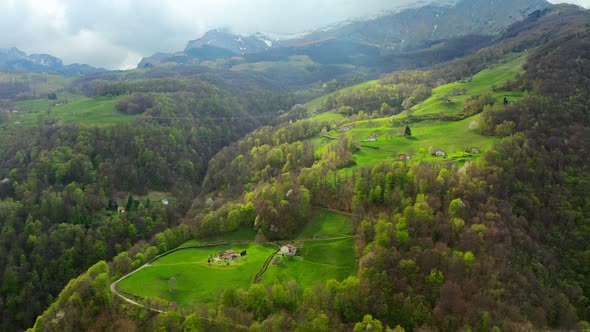 Aerial Video of the Small Town of Pasturo in Lombardy North Italy Showing Mountain Panorama Forest alt