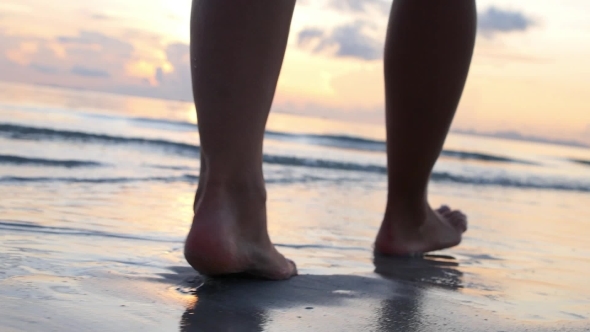 Woman Legs Walking On Beach In Sea Waves alt