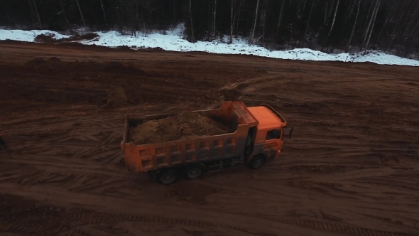 Aerial Shot Truck Of Sand Is Moving In Reverse alt