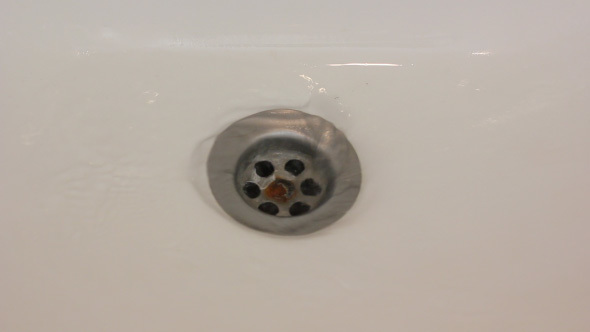 Water Is Swirling Down The Sink Drain