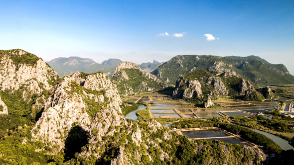 Shrimp Farm in Pond among Mountain and Sea