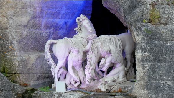A White Statue of Men and Horse on the Fountain