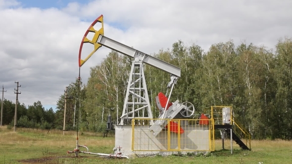 Oil Pump Working In The Forest. Oil Industry alt