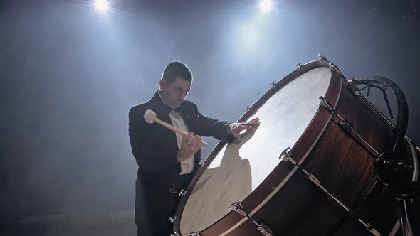 Drummer Playing a Bass Drum in a Concer