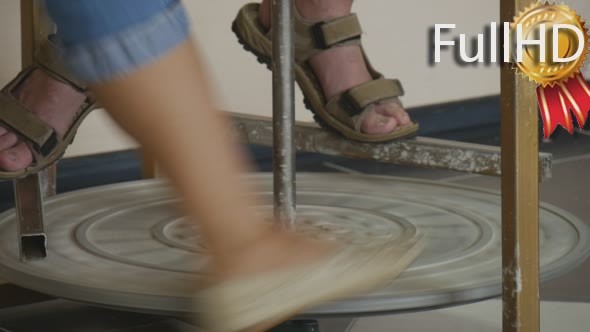 Male Potter Craftsman's Legs Feet Upon a Disk of alt