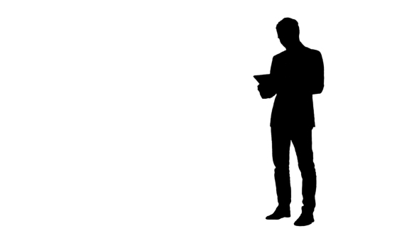 Silhouette Happy Young Man Using Digital Tablet  alt