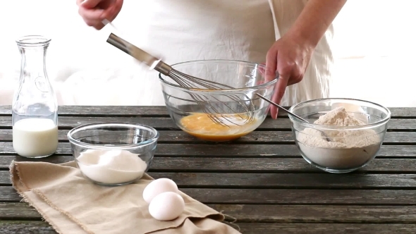 Woman Mixes Ingredients For Sponge Cake. Rustic