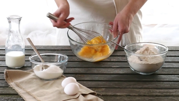 Woman Mixes Ingredients For Sponge Cake