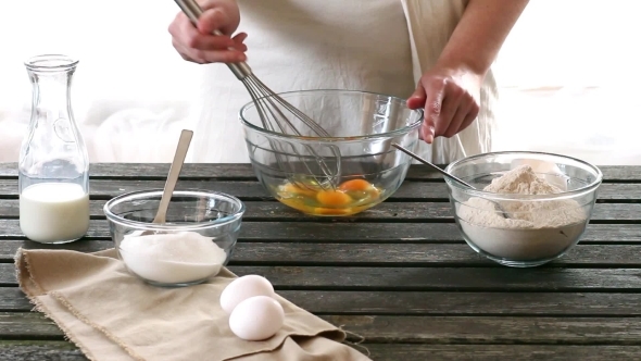 Woman Mixes Ingredients For Sponge Cake