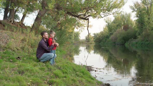 Dad Teaches Son to Fish alt
