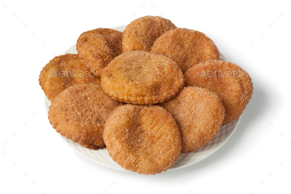 Heap of sugared fried apple fritters or appelflappen