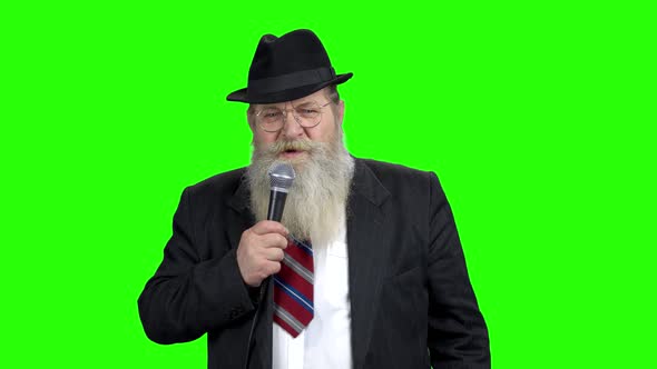 Elderly Businessman Talking on Green Screen alt