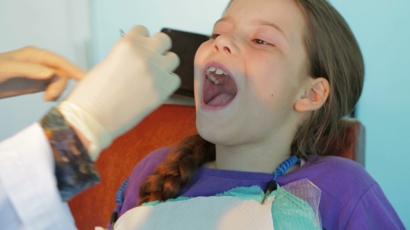 Dentist Applying Staples