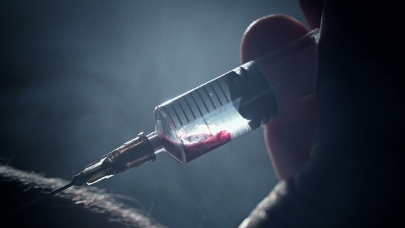 Junkie Addict Injects Heroin Syringe Into a Vein alt