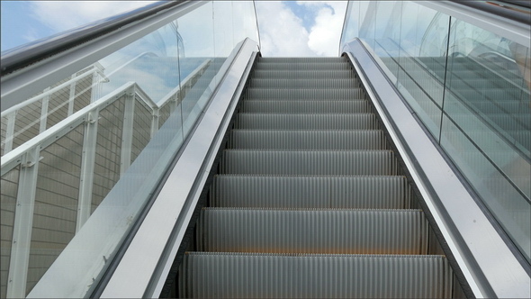 The Going Up Motion of the Escalator in a Building