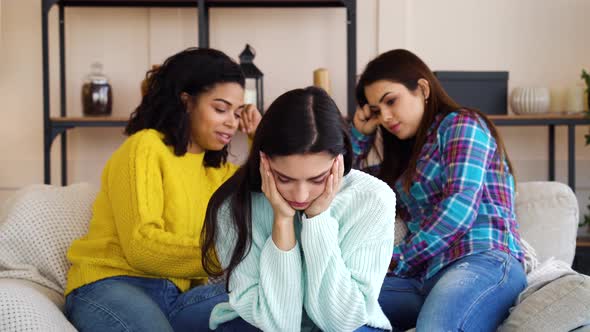 Evil females gossiping about pretty roommate on sofa alt