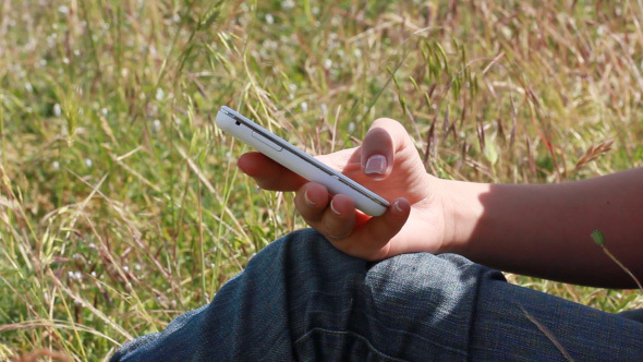 Girl Using Mobile Cell Phone For Text Messaging