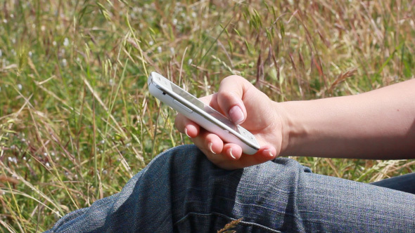 Girl Using Mobile Cell Phone For Text Messaging