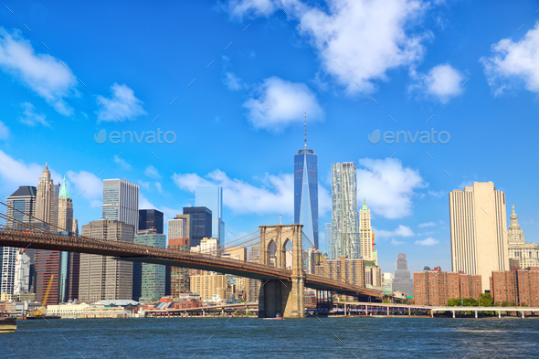 Manhattan skyline with Brooklyn Bridge - Stock Photo - Images
