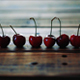 Ripe Red Cherries Placed In Line On Wooden Table - VideoHive Item for Sale