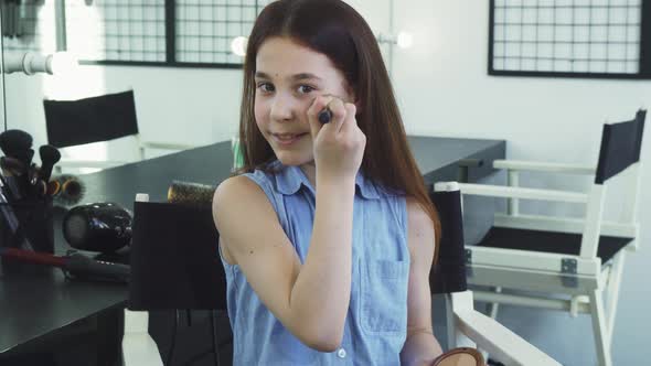 Little Cute Girl Having Fun Applying Makeup Smiling Happily alt
