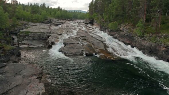 Waterfall In Sweden On a Stormy Mountain River