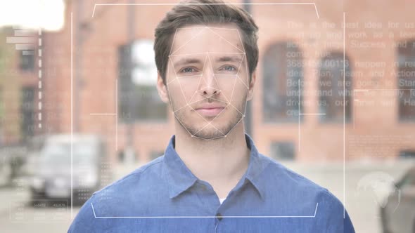 Identification of Young Man By Biometric Facial Recognition Scanning System alt