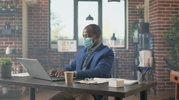 African American Businessman Analyzing Data Sales Report alt